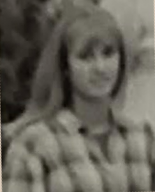 Then-junior Jill Lomheim posts in The Accolade staff photo in the 1996 Helios yearbook.